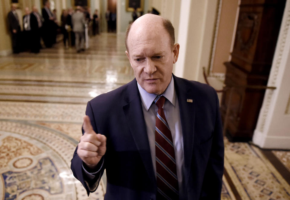 Image: Sen. Chris Coons answers questions from reporters at the Capitol on Jan. 21, 2020.