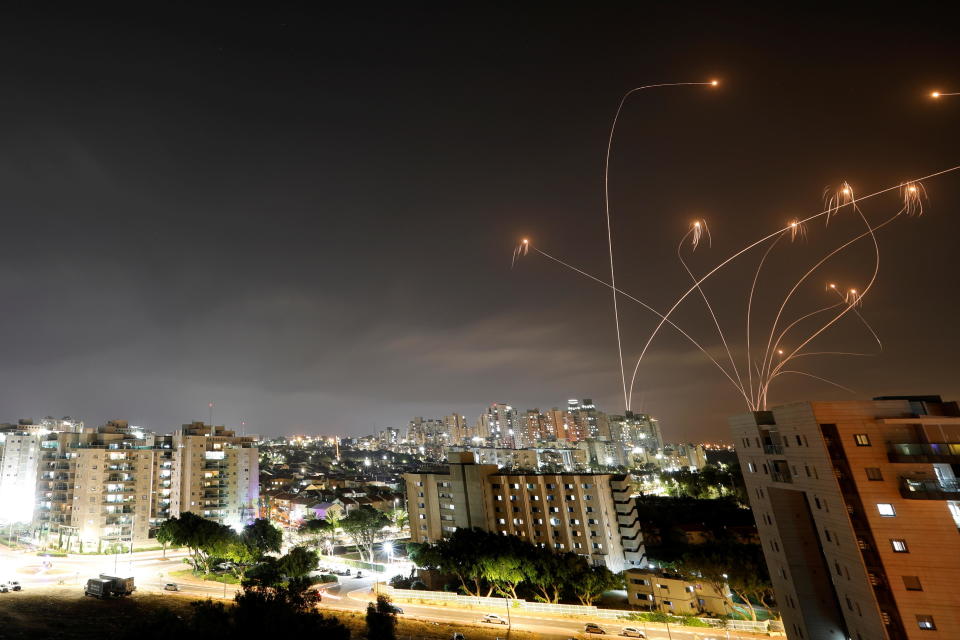 Streaks of light are seen as Israel's Iron Dome anti-missile system intercepts rockets launched from the Gaza Strip towards Israel, as seen from Ashkelon, Israel, on Monday, May 10, 2021. / Credit: AMIR COHEN / REUTERS