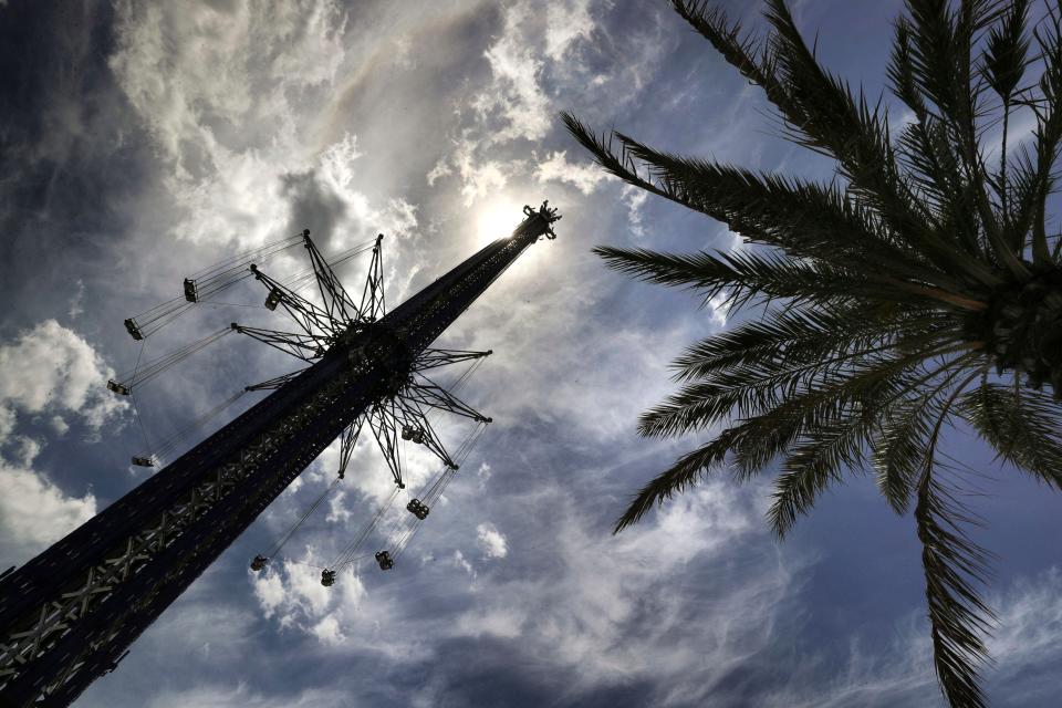 In this April 23, 2020 file photo, the Orlando Starflyer swing ride remains closed on a deserted International Drive as the response to the coronavirus pandemic takes its toll on the entertainment, shopping and dining district south of downtown Orlando, Fla. A worker doing an inspection on the popular central Florida thrill ride was killed Monday, Sept. 14 after falling more than 50 feet (15.2 meters).