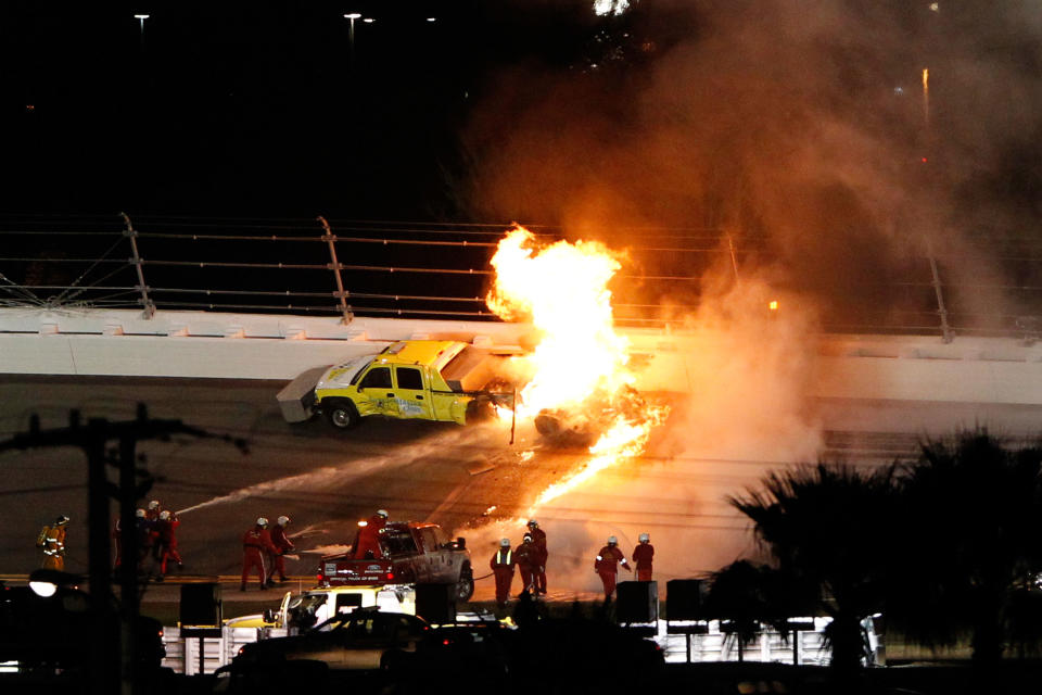 DAYTONA BEACH, FL - FEBRUARY 27: Safety workers try to extinguish a fire from a jet dryer after being hit by Juan Pablo Montoya, driver of the #42 Target Chevrolet, under caution during the NASCAR Sprint Cup Series Daytona 500 at Daytona International Speedway on February 27, 2012 in Daytona Beach, Florida. (Photo by Streeter Lecka/Getty Images)