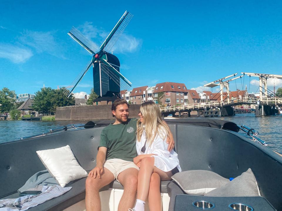 The writer and her partner on a boat in the Netherlands