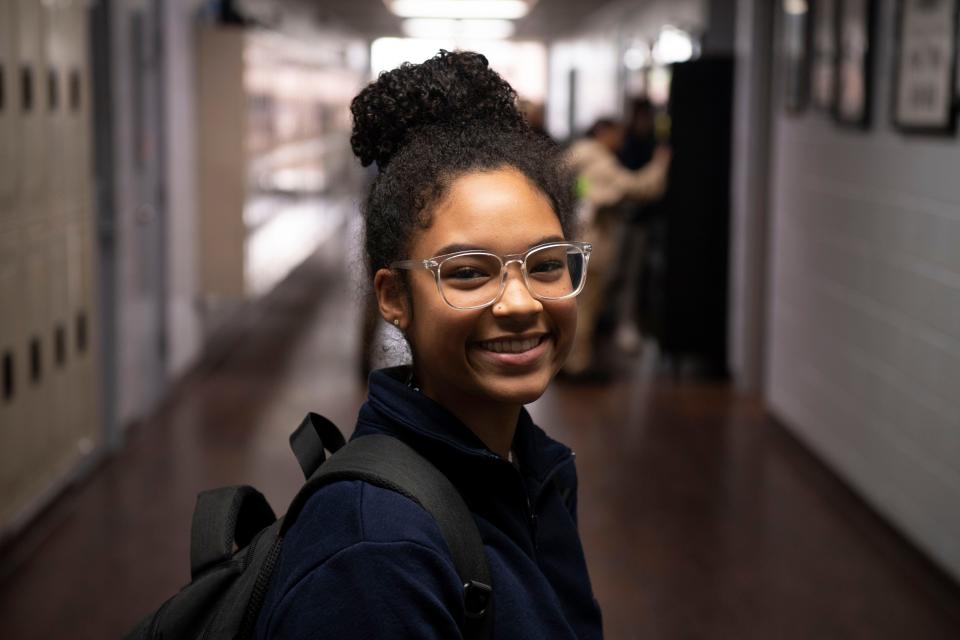 Alex Tyler, senior at Lighthouse Christian School, stands in the halls of her school in Antioch, Tenn., Thursday, Oct. 26, 2023. She is one of more than 2,400 students in three Tennessee counties who are enrolled in private schools with tuition and other expenses paid with public funding through the state’s Education Savings Accounts program this year.