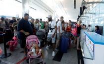 Passengers are seen at check-in points at Enfidha-Hammamet International Airport