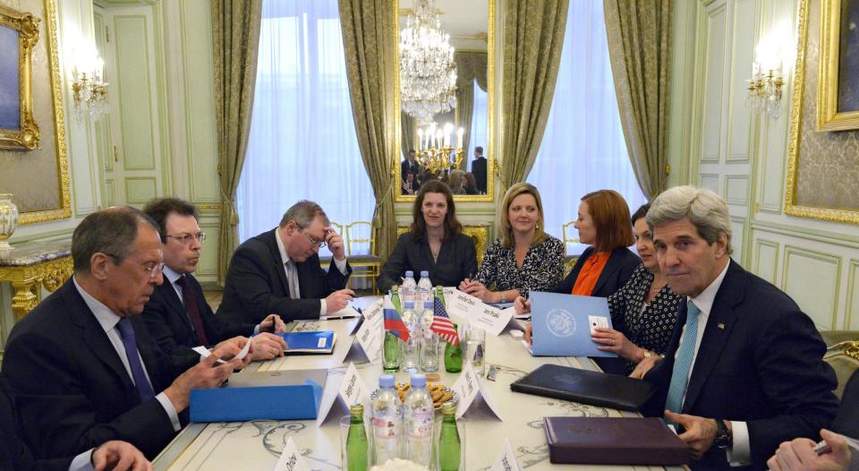 U.S. Secretary of State John Kerry, right, and Russian Foreign Minister Sergey Lavrov, left, prepare for talks at the Russian Ambassador's residence to discuss Ukraine, in Paris Sunday March 30, 2014. Kerry traveled to Paris for a last minute meeting with Lavrov. (AP Photo)