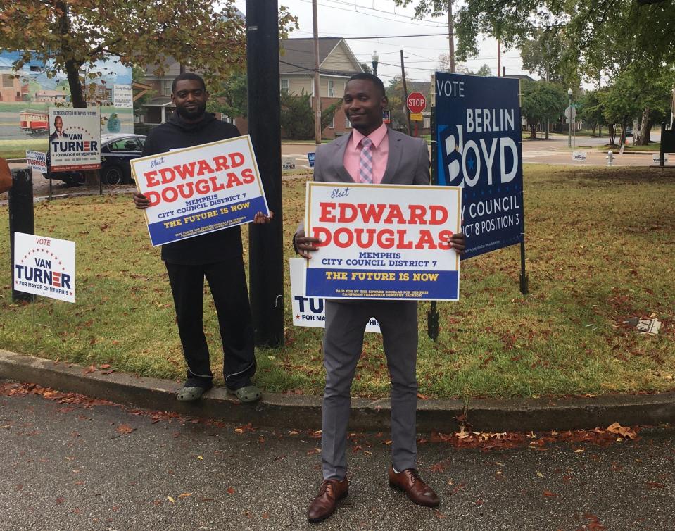 Edward Douglas, right, a candidate for City Council District 7, campaigns outside the Greenlaw Community Center polling place on Thursday, Oct. 5, 2023, in Memphis.