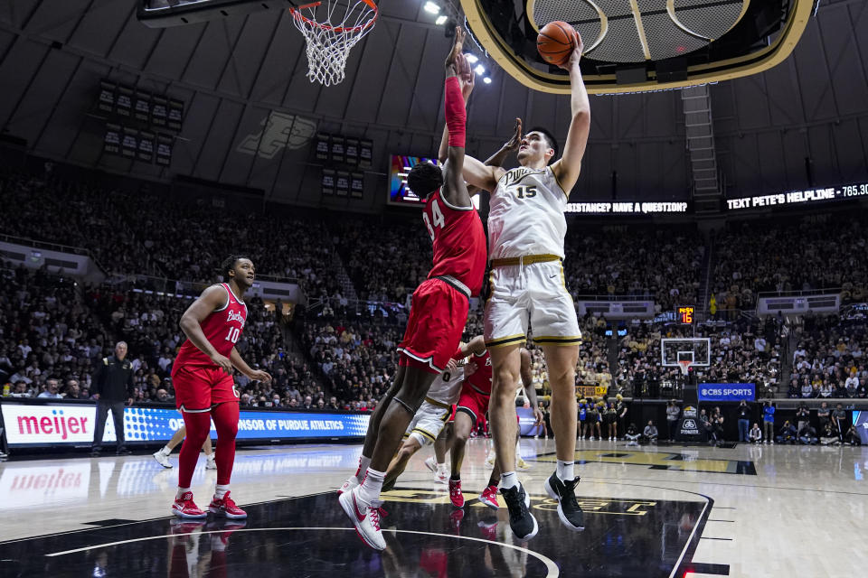 Purdue center Zach Edey (15) shoots over Ohio State center Felix Okpara (34) in the second half of an NCAA college basketball game in West Lafayette, Ind., Sunday, Feb. 19, 2023. Purdue defeated Ohio State 82-55. (AP Photo/Michael Conroy)