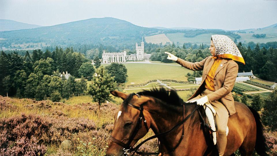 The Queen on horse looking to Balmoral