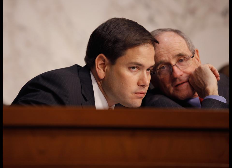 WASHINGTON, DC - FEBRUARY 28:  Senate Foreign Relations Committee members Sen. Marco Rubio (R-FL) and Sen. James Risch (R-ID) talk while U.S. Secretary of State Hillary Clinton testifies before the committee about the department's FY2013 international affairs budget February 28, 2012 in Washington, DC. Clinton faced questions ranging from the cost of embassies in Iraq and the Middle East to the START Treaty with Russia.  (Photo by Chip Somodevilla/Getty Images)