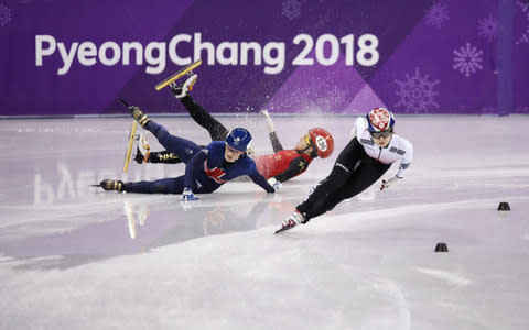 Elise Christie crashes off the ice during the 1500m semi-final - Credit: Getty Images