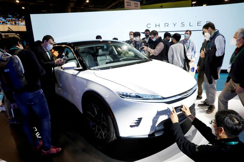 FILE PHOTO: Attendees take a look at the Chrysler Airflow Concept electric vehicle