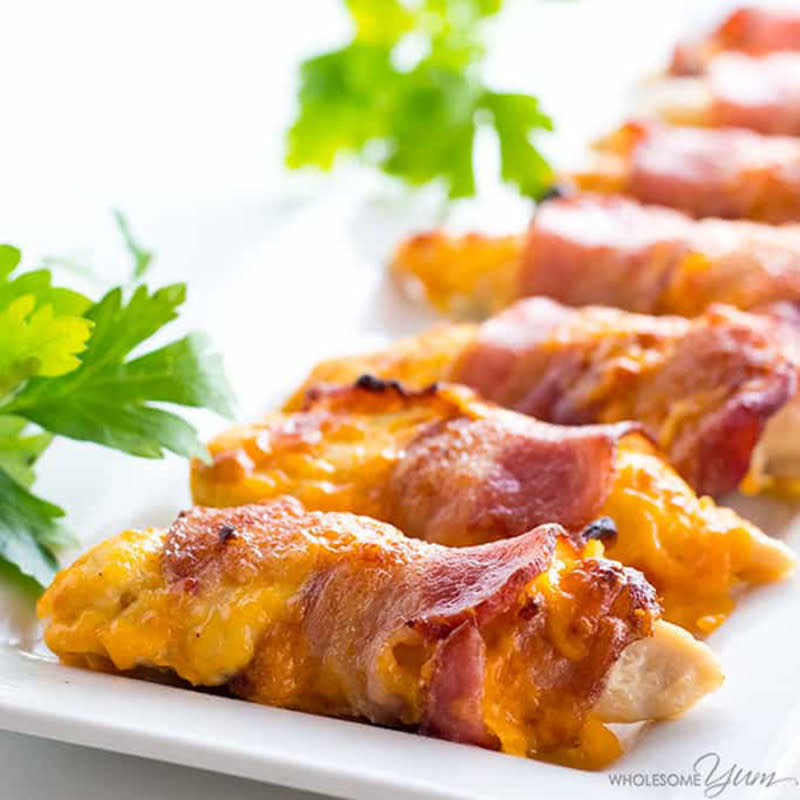 <p>Wholesome Yum</p><p>You probably already have the ingredients to make these! This super-simple recipe is perfect for feeding a party.</p><p><strong>Get the recipe: </strong><a href="https://www.wholesomeyum.com/recipes/bacon-wrapped-chicken-tenders-recipe/" rel="nofollow noopener" target="_blank" data-ylk="slk:Baked Bacon Wrapped Chicken Tenders Recipe;elm:context_link;itc:0;sec:content-canvas" class="link rapid-noclick-resp"><strong>Baked Bacon Wrapped Chicken Tenders Recipe</strong> </a></p>