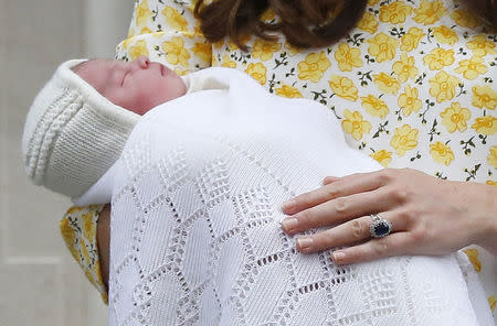 Britain's Catherine, Duchess of Cambridge, holds her baby daughter, Charlotte Elizabeth Diana, outside the Lindo Wing of St Mary's Hospital, in London, Britain May 2, 2015. REUTERS/Suzanne Plunkett