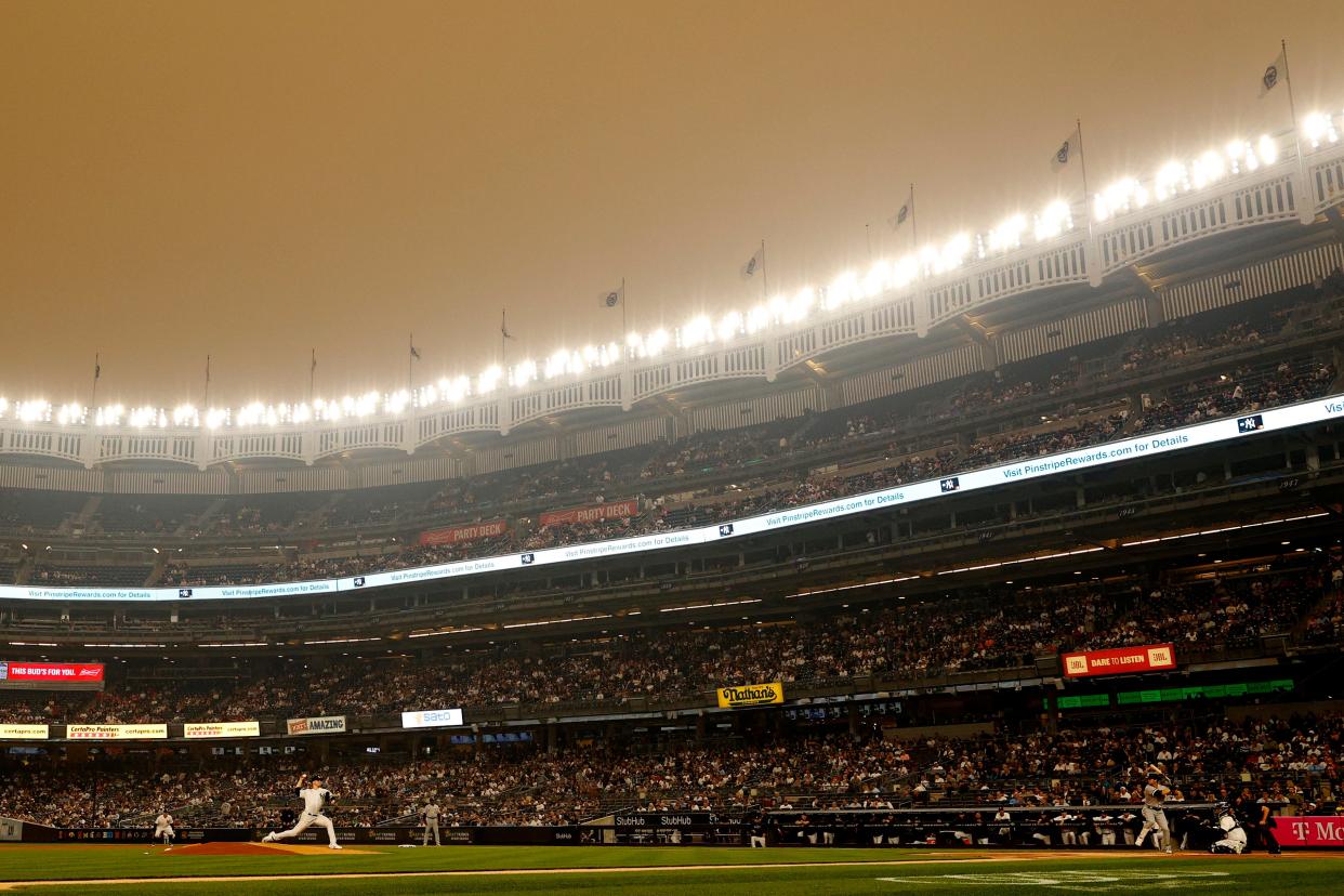 NEW YORK, NEW YORK - JUNE 06: General view of hazy conditions resulting from Canadian wildfires as Clarke Schmidt #36 of the New York Yankees pitches during the first inning against the Chicago White Sox at Yankee Stadium on June 06, 2023 in the Bronx borough of New York City.