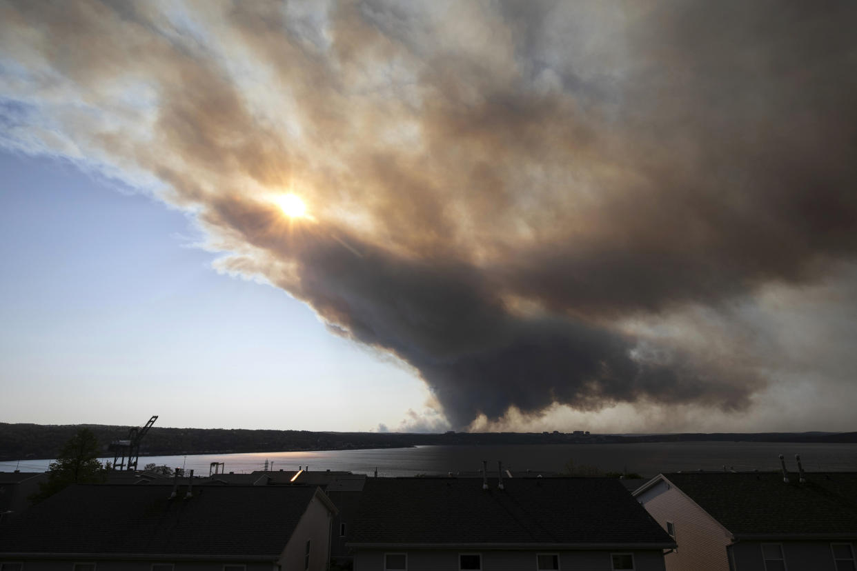 Thick plumes of smoke fill the sky as an out-of-control fire in a suburban community quickly spreads, engulfing multiple homes and forcing the evacuation of local residents in Halifax, Nova Scotia.