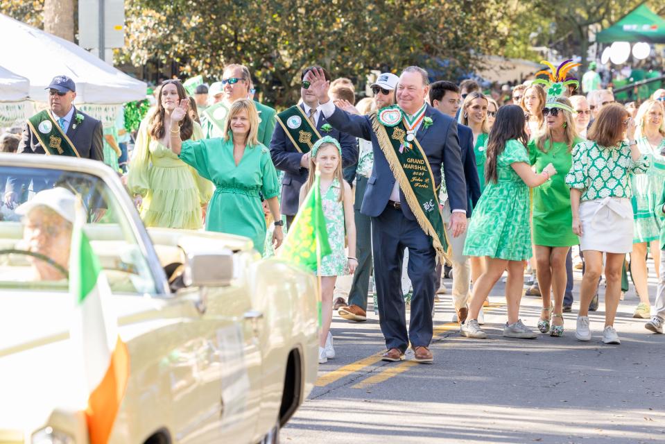 What a day for Parade Grand Marshal John Forbes as he walks down Abercorn Street with his family and marshal's aides in the 200th St. Patrick's Day Parade.