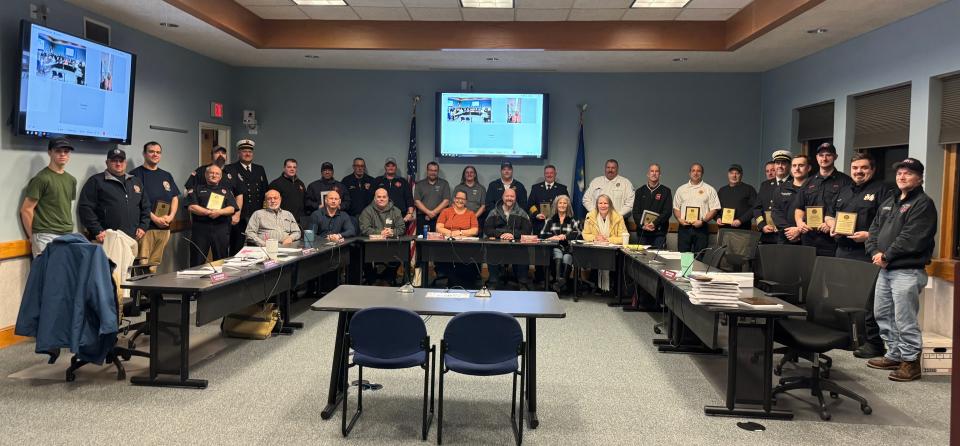 First responders to the Ballouville Mill fire pose with the Killingly Town Council after being recognized at the town council meeting Tuesday night.