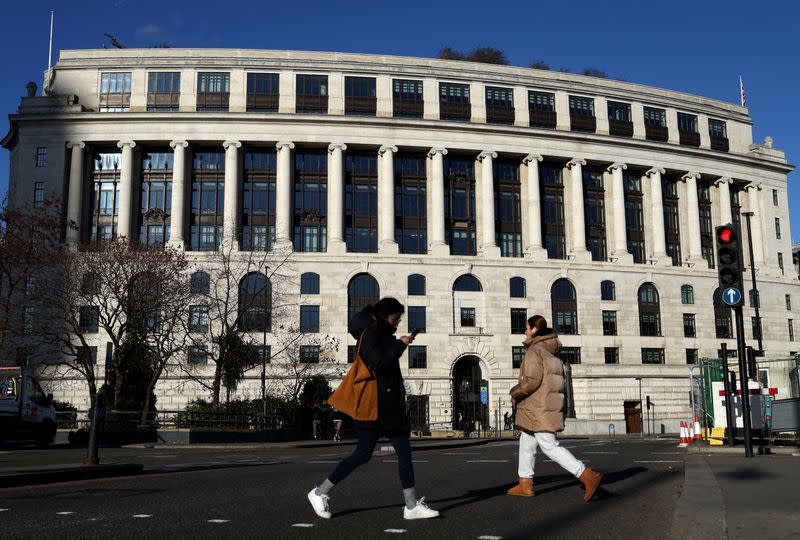 FILE PHOTO: People walk past the Unilever headquarters in London