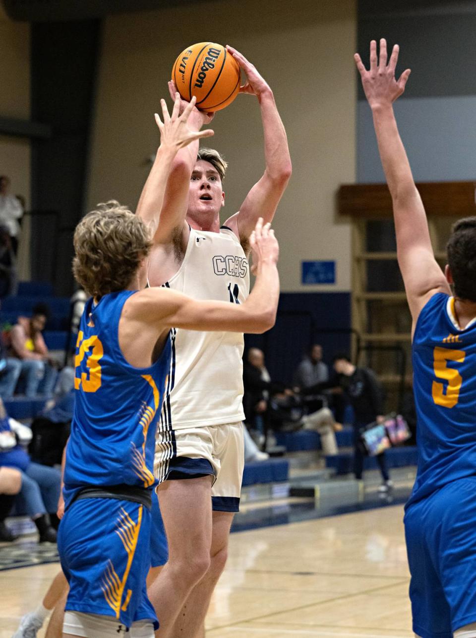 Central Catholic’s Wesley Payne scores over Ripon Christian defenders during the Mark Gallo Invitational Basketball Tournament at Central Catholic High School in Modesto, Calif., Saturday, Dec. 9, 2023. Central Catholic won the game 64-32 to place third in the tournament.