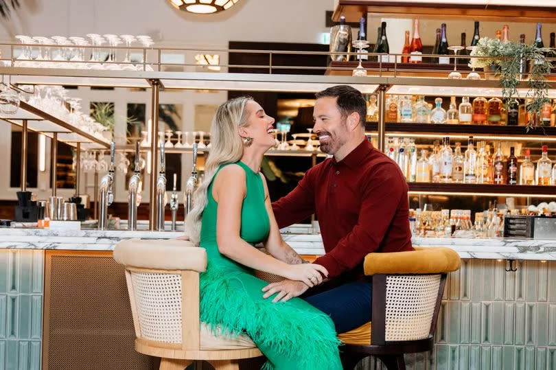 Helen Flanagan and Robbie Talbot sitting in a hotel bar