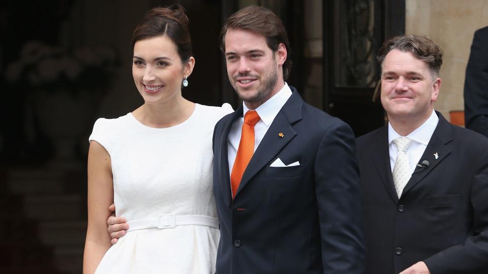 Claire Lademacher in a peplum look on red carpet with husband