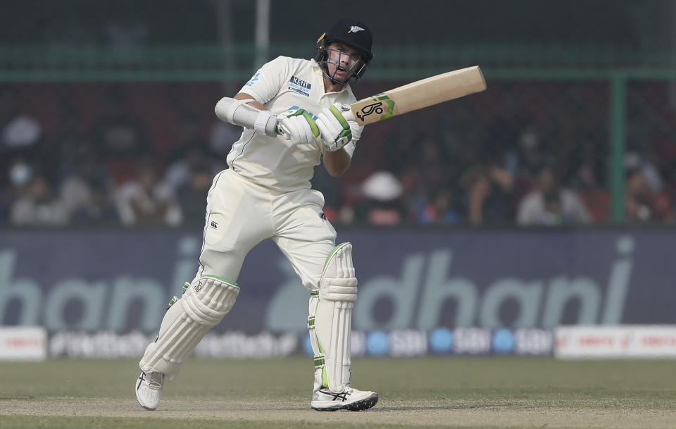 New Zealand's Tom Latham watches the ball as it crosses the boundary during the day three of their first test cricket match with India in Kanpur, India, Saturday, Nov. 27, 2021. (AP Photo/Altaf Qadri)