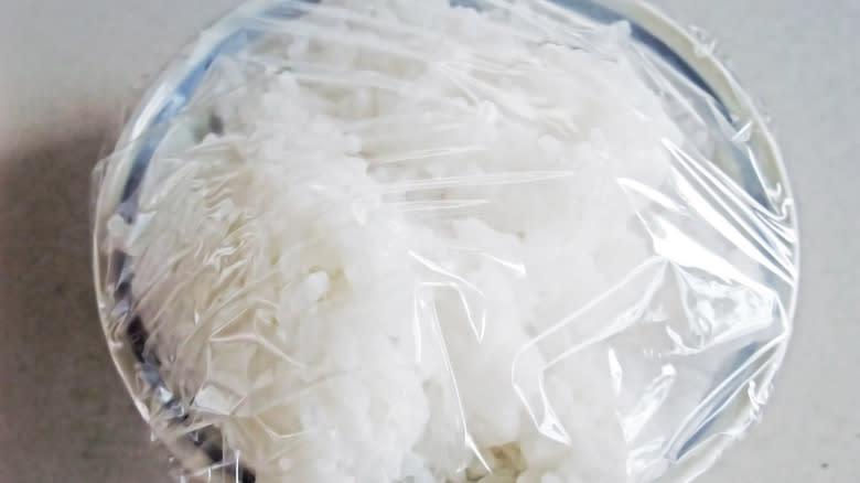Leftover rice under plastic wrap