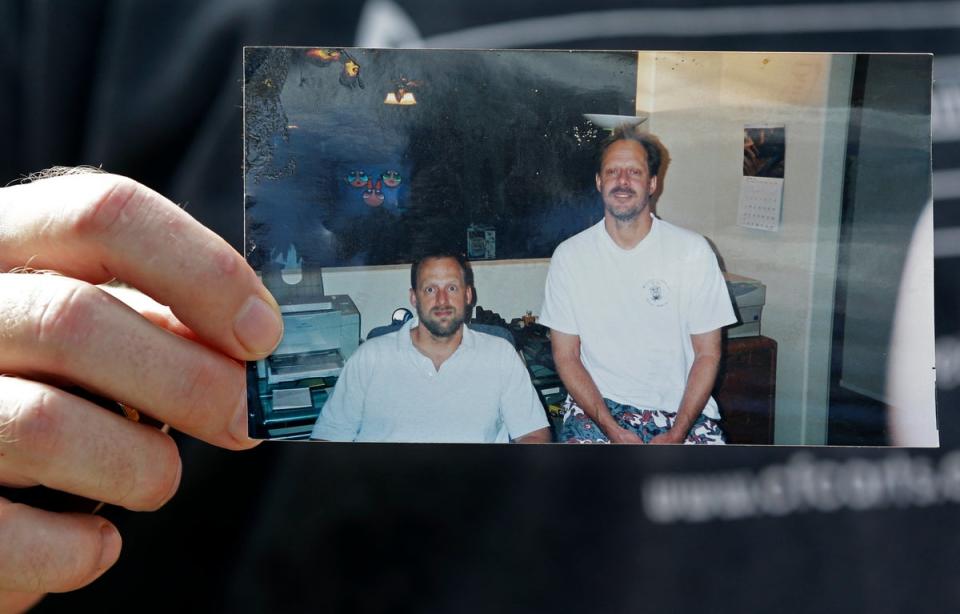 Eric Paddock holds a photo of himself, at left, and his brother, Las Vegas shooter Stephen Paddock (Copyright 2017 The Associated Press. All rights reserved.)