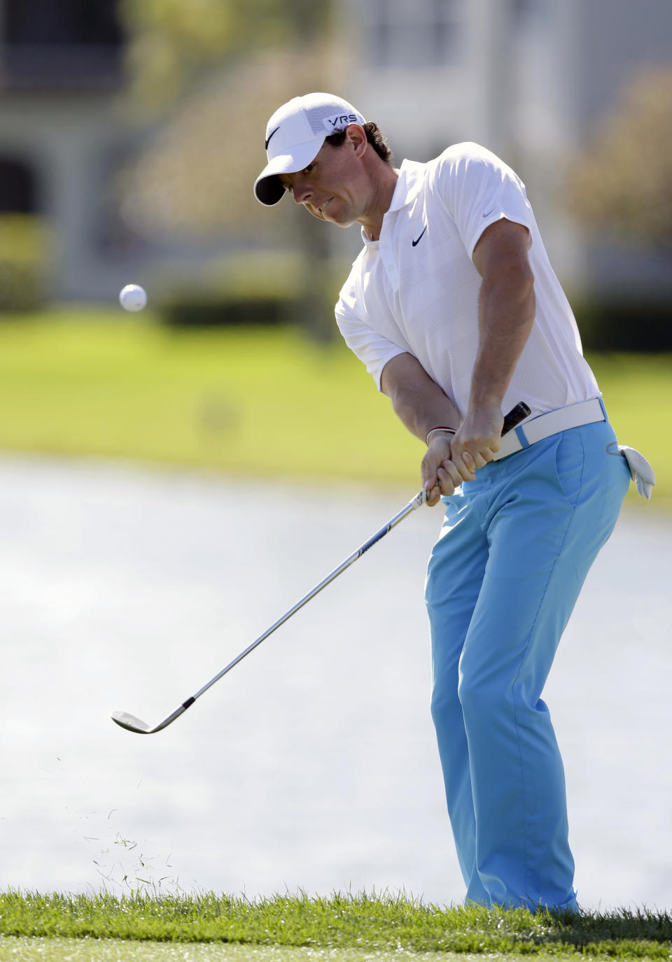 Rory McIlroy of Northern Ireland, chips onto the green on the sixth hole during the third round of the Honda Classic golf tournament, Saturday, March 1, 2014 in Palm Beach Gardens, Fla. (AP Photo/Wilfredo Lee)