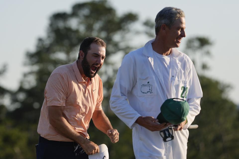 Scottie Scheffler celebrates his win at the Masters golf tournament at Augusta National Golf Club Sunday, April 14, 2024, in Augusta, Ga. (AP Photo/David J. Phillip)