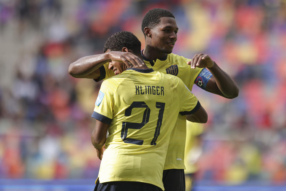 Ecuador's Justin Cuero, back, is congratulated after scoring his team's 4th goal during a FIFA U-20 World Cup Group B soccer match at the Madre De Ciudades stadium in Santiago del Estero, Argentina, Friday, May 26, 2023. (AP Photo/Nicolas Aguilera)