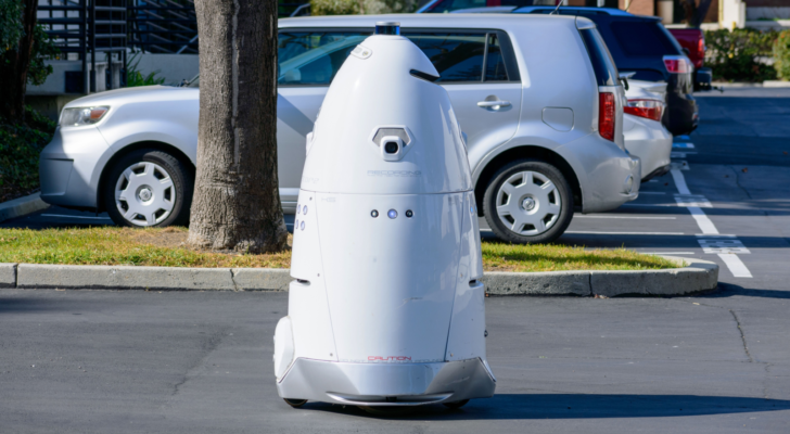 Knightscope (KSCP) security robot patrols an outdoor parking lot