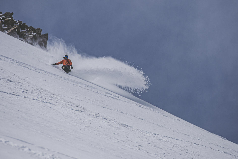 This May 17, 2019 photo provided by the Mammoth Mountain ski area shows a snow boarder making his way downhill in fresh snow at Mammoth Mountain ski area. Late spring wintry weather has brought rain, wind and snow to California, including a dusting of white on mountain peaks east of Los Angeles. (Peter Morning/Mammoth Mountain ski area via AP)