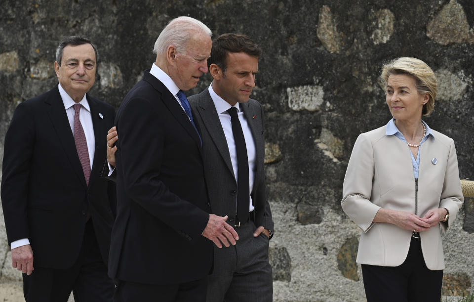 From left, Italian Prime Minister Mario Draghi, US President Joe Biden, President of France, Emmanuel Macron and European Commission Ursula von der Leyen speak after posing for photos for the Leaders official welcome and group photo session, during the G7 Summit, in Carbis Bay, Cornwall, England, Friday, June 11, 2021. (Leon Neal/Pool Photo via AP)