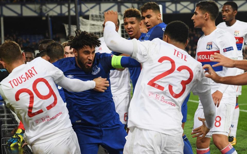 Ashley Williams goes toe-to-toe with Lyon players during his side's 2-1 defeat in the Europa League - Getty Images Europe