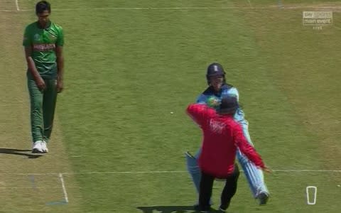 Roy accidentally clatters the ump! - Credit: Sky