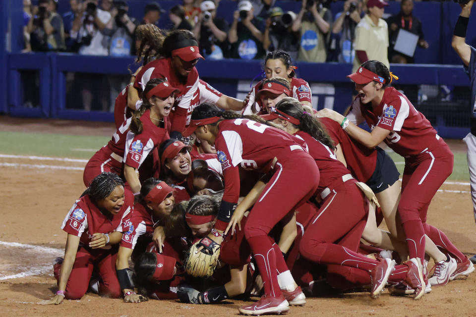 Oklahoma players celebrate after defeating Florida State in the NCAA Women's College World Series softball championship series Thursday, June 8, 2023, in Oklahoma City. (AP Photo/Nate Billings)