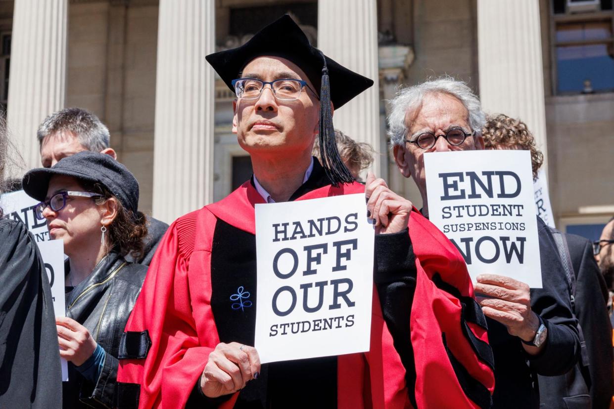 <span>Columbia University professors dressed in commencement regalia protest the university's recent actions against students in New York last week.</span><span>Photograph: Sarah Yenesel/EPA</span>