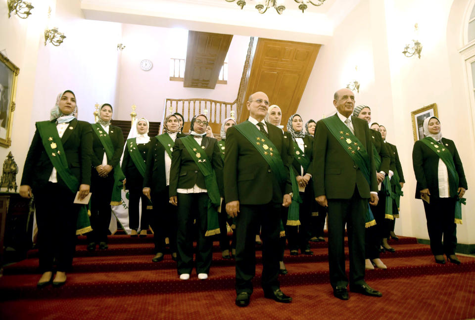 Judges attend a swearing-in ceremony before Egypt’s State Council’s chief judge Mohammed Hossam el-Din in a celebratory event in Cairo, Egypt, Tuesday, Oct. 19, 2021. Ninety eight women have become the first female judges to join the council, one of the country’s main judicial bodies. The swearing-in came months after President Abdel Fattah el-Sissi asked for women to join the State Council and the Public Prosecution, the two judicial bodies that until recently were exclusively male. (AP Photo/Tarek Wajeh)