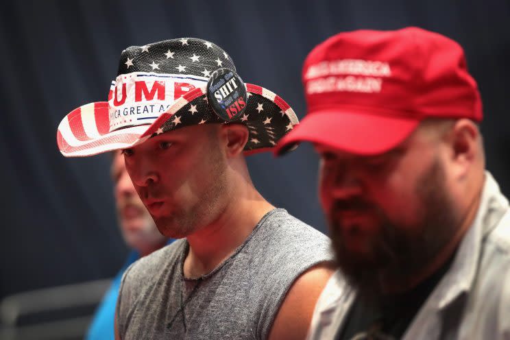 Supporters shop for campaign merchandise before the start of a President Trump’s rally in Iowa on June 21. (Photo: Scott Olson/Getty Images)