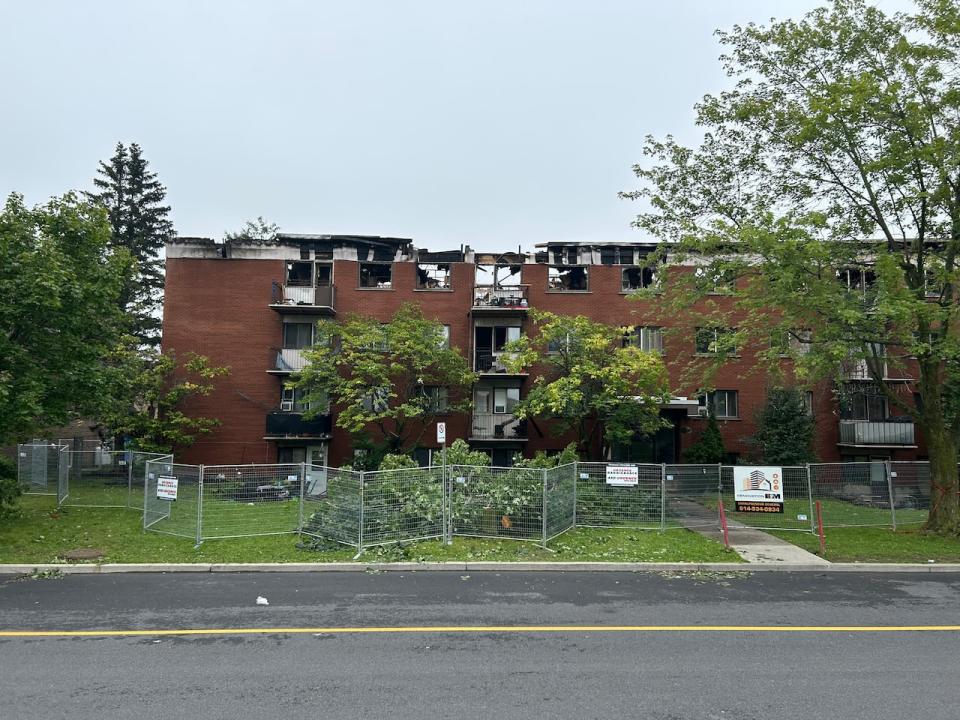 A fire gutted much of a building on Saint-Hubert Street in Chateauguay, Que., seen here on Friday, Aug. 25, 2023, one day after the fire.