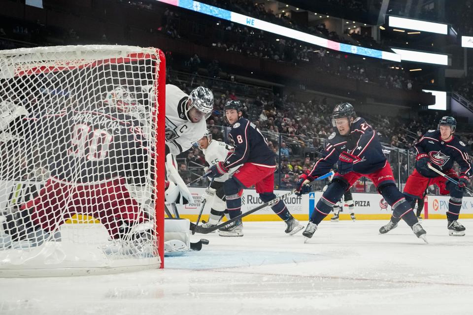 Dec 5, 2023; Columbus, Ohio, USA; Columbus Blue Jackets defenseman Adam Boqvist (27) and goaltender Elvis Merzlikins (90) make a save on a shot from Los Angeles Kings center Anze Kopitar (11) during the second period of the NHL game at Nationwide Arena.