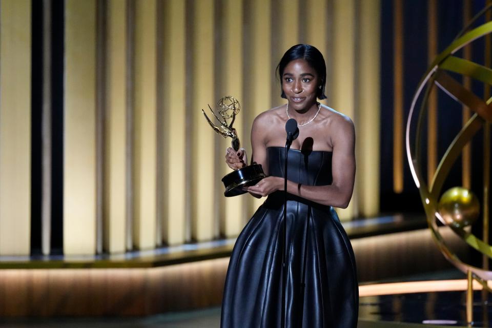 Ayo Edebiri accepts the award for outstanding supporting actress in a comedy series during the 75th Emmy Awards at the Peacock Theater in Los Angeles on Monday, Jan. 15, 2024.