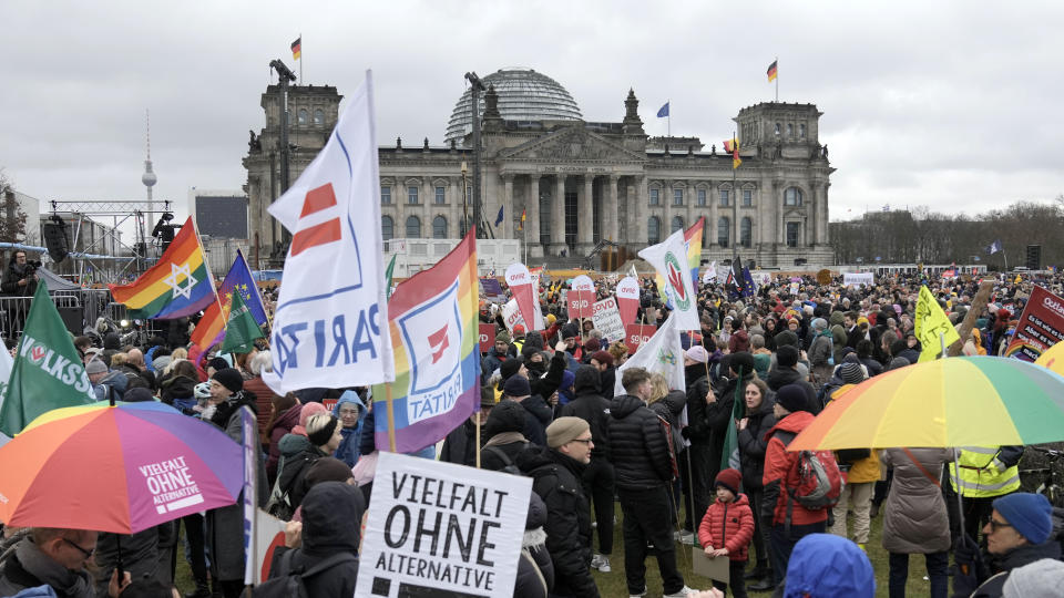 People protest in front of Germany's parliament Reichstag at a demonstration against the AfD party and right-wing extremism in Berlin, Germany, Saturday, Feb. 3, 2024 (AP Photo/Ebrahim Noroozi)