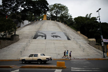 Stairs with tiles depicting the eyes of late Venezuelan President Hugo Chavez are seen during a nationwide election for new mayors, in Caracas, Venezuela December 10, 2017. REUTERS/Marco Bello