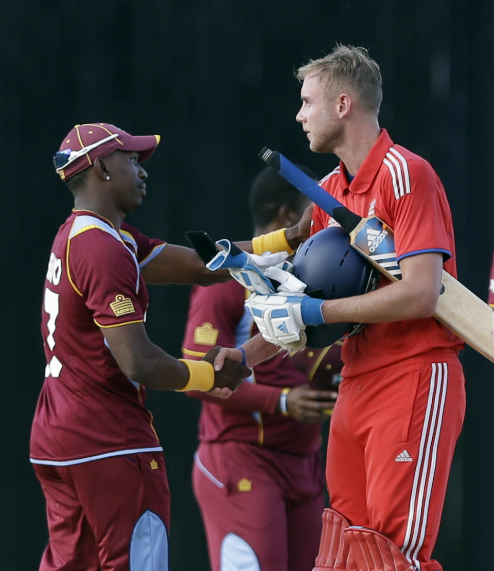 England's captain Stuart Broad, right, greets West Indies' captain Dwayne Bravo after the teams' second one-day international cricket match at Sir Vivian Richards Cricket Ground in St. John's, Antigua, Sunday, March 2, 2014. England won by three wickets. (AP Photo/Ricardo Mazalan)