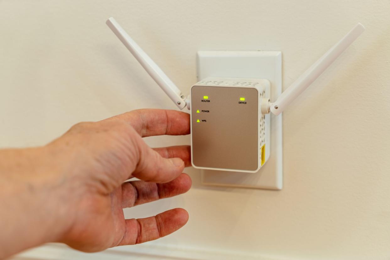 WiFi Extender in electric outlet.