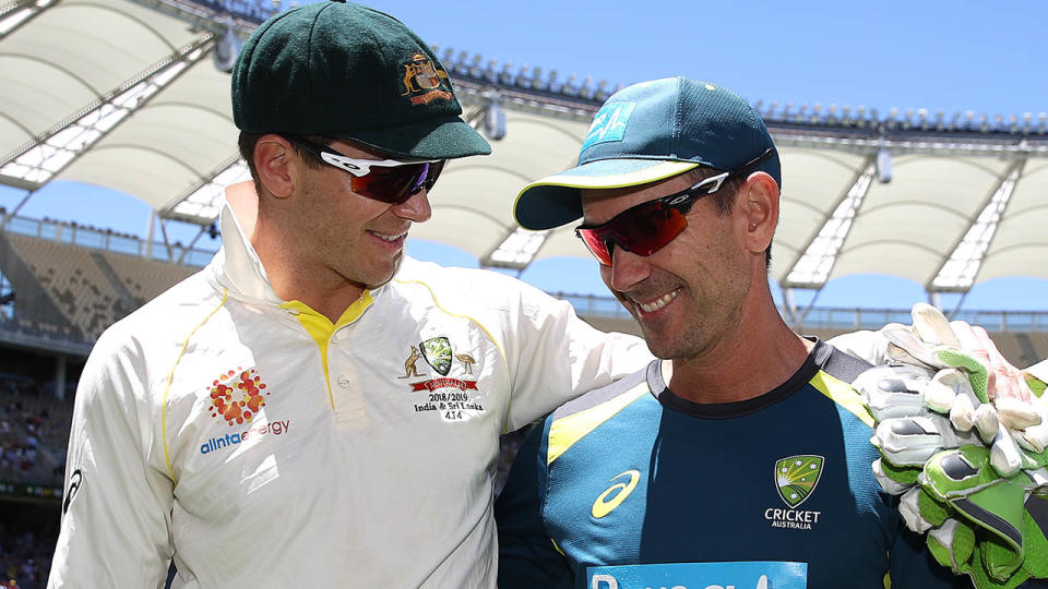 Justin Langer celebrates with Tim Paine. (Photo by Ryan Pierse/Getty Images)