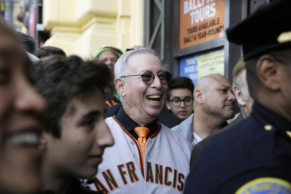 Tom O'Doul, a cousin of baseball great Lefty O'Doul, smiles as San Francisco Mayor London Breed speaks during the opening of Lefty O'Doul's new 20,000 square foot Baseball Ballpark Buffet & Café at Fisherman's Wharf, Tuesday, Nov. 20, 2018, in San Francisco. The popular Union Square bar and restaurant Lefty O'Doul's closed in January 2017 due to a dispute between the owner and his landlord, but now the restaurant has returned on the wharf. Lefty O'Doul's was named after the well-known and respected New York Giants star outfielder. With a .398 batting average, he boasted the highest average out of any outfielder in the 20th century. (AP Photo/Eric Risberg)