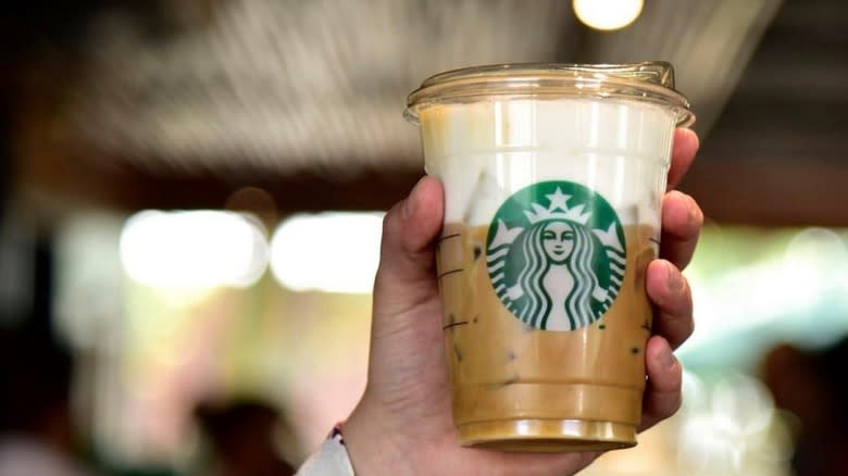 hand holding Starbucks iced coffee