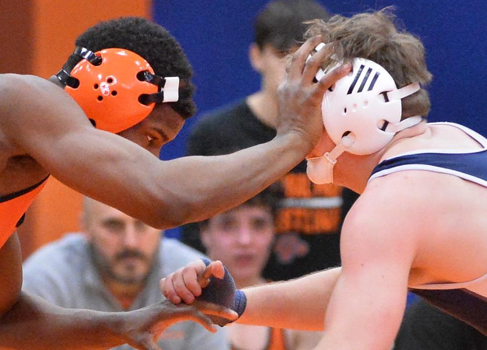 Cathedral Prep's Jaden Crockett, left, and McDowell's Caleb Butterfield compete at 160 pounds during the District 10 Class 3A team wrestling tournament at Prep's Hagerty Family Events Center in Erie on Feb. 2, 2023. Prep and McDowell will again be among the district's best Class 3A teams in 2023-24.